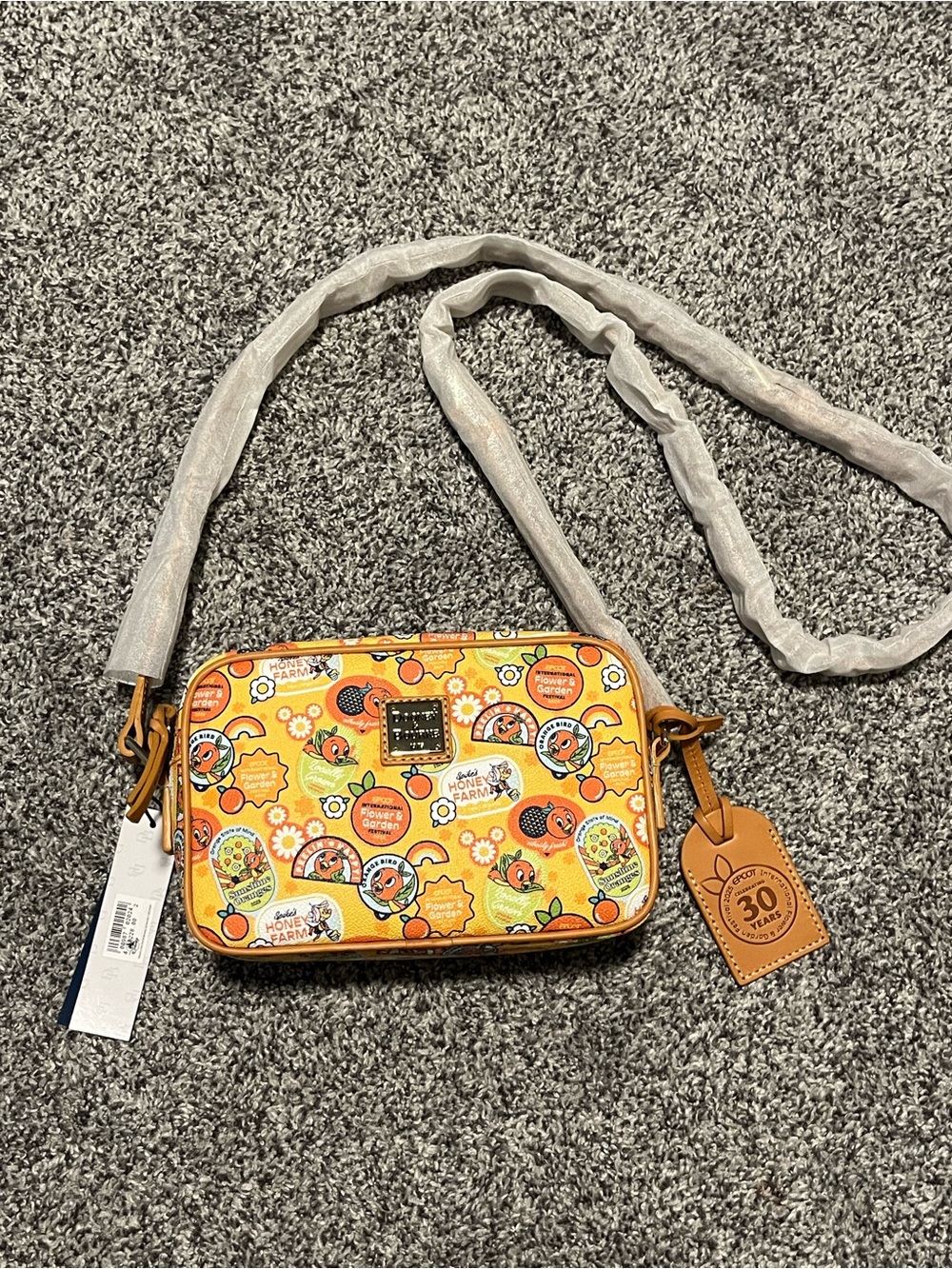 Dooney & Bourke Disney Epcot 2025 Flower & Garden Orange Bird Crossbody - Picture 1 of 7